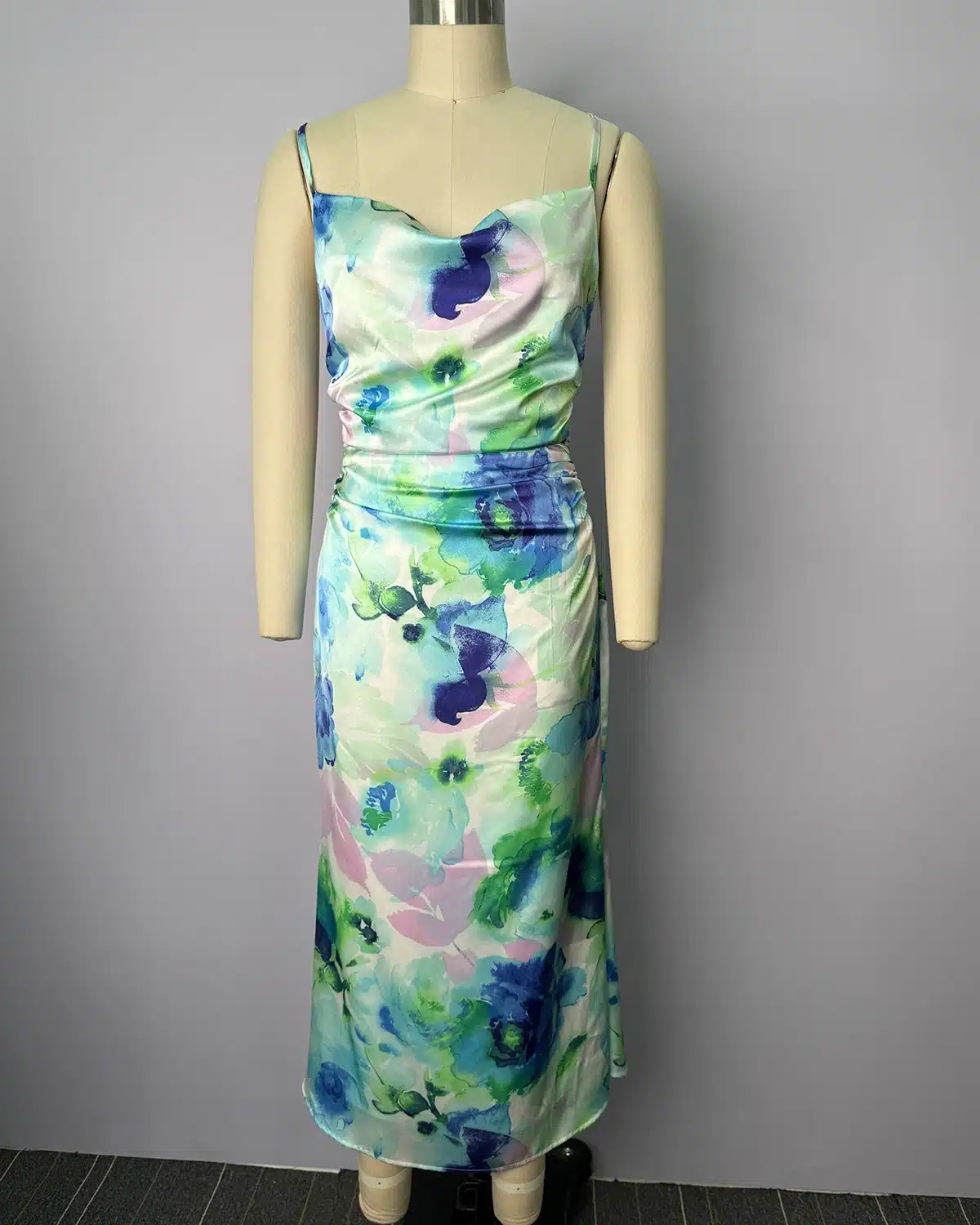 Floral print sleeveless maxi dress displayed on a dress form for garment development