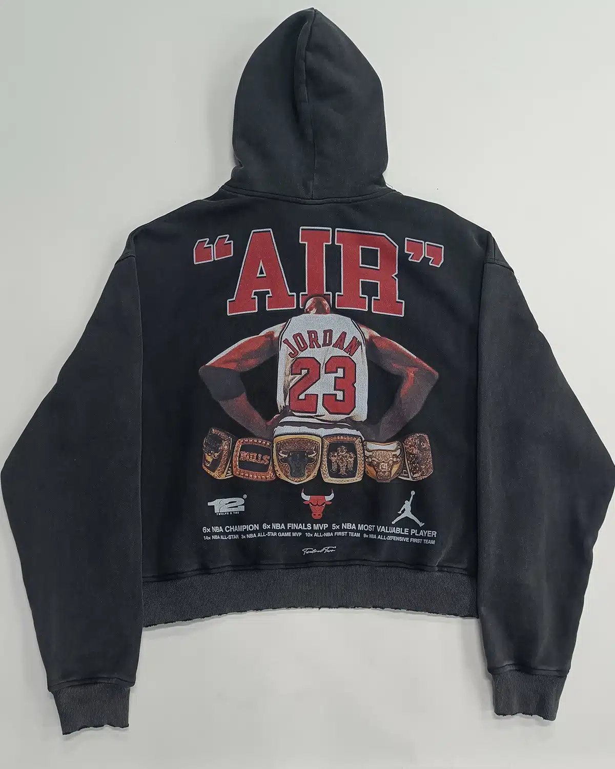 Black pullover hoodie with large back graphic print and ribbed cuffs and hem