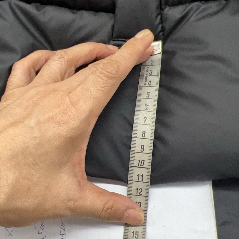 Garment detail being measured with a tape during apparel quality control inspection